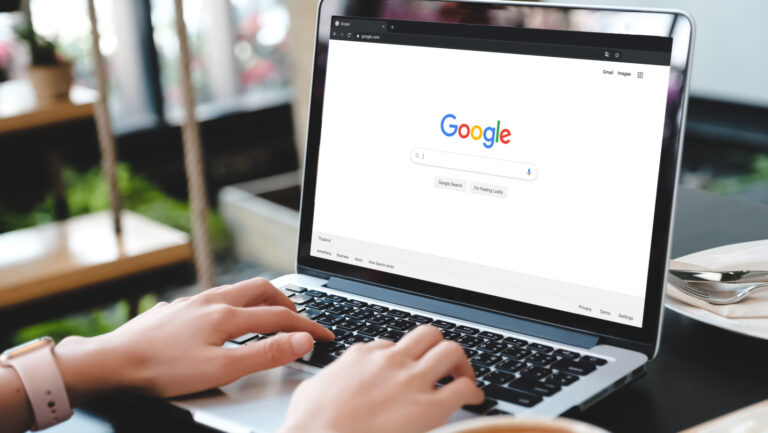 Person sitting by the computer, searching for answers online