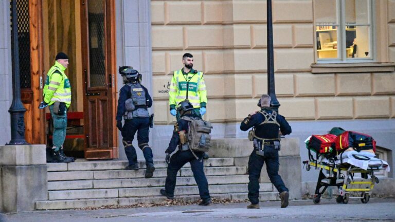 Emergency responders and police outside Campus Risbergska in Örebro, following the tragic mass shooting incident