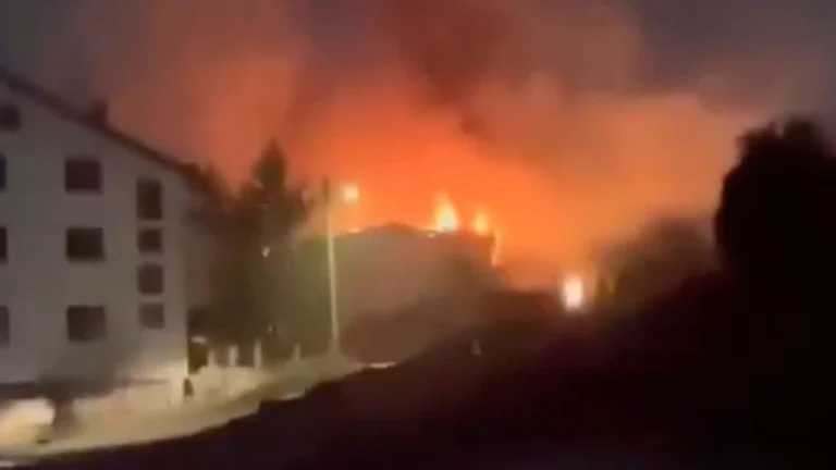 The aftermath of the devastating fire at Pulse nightclub in Kocani, North Macedonia, showing emergency responders and the charred remains of the venue