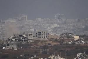 Aftermath of the Israel Gaza Attack—destroyed buildings and civilians searching for survivors amidst the rubble.